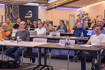 Attendees sitting attentively in rows in a seminar room of Paravan GmbH – focus on a learning or informational event