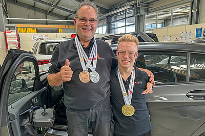 A smiling young man in a wheelchair confidently positioned in front of a PARAVAN vehicle – symbolizing independent mobility.