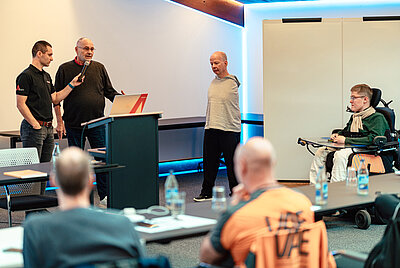 Presentation or lecture by Paravan GmbH with speakers addressing an audience in a training or conference room