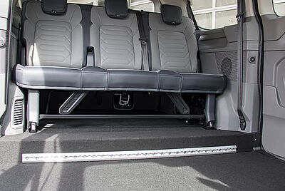  A lowered floor, visible as a step in the floor just before the rear seat begins.