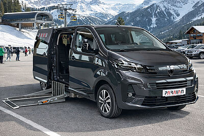 Driver using hand controls with the PARAVAN Space Drive system.