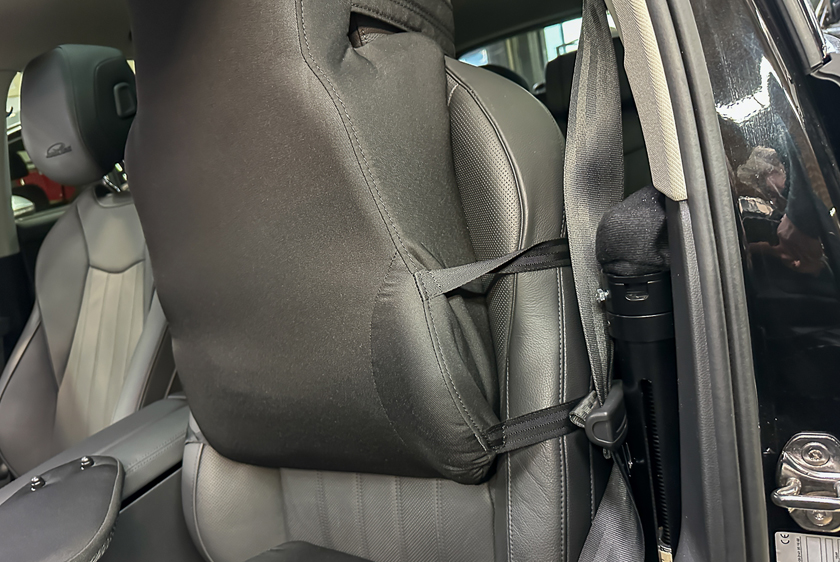 A driver's seat equipped with an ergonomic backrest.  