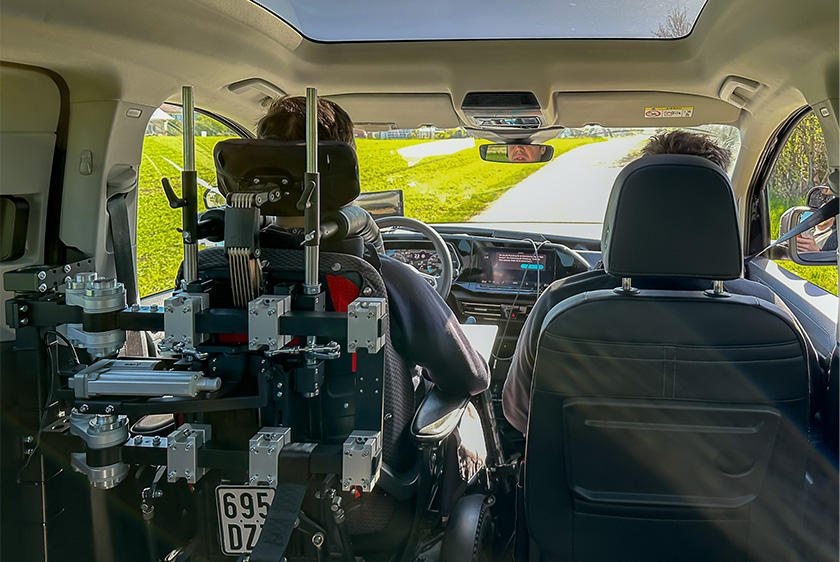 From the rear of the vehicle, you can see the backs of the two front seats. The driver's seat is also equipped with a headrest and lumbar support. 