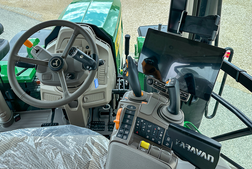 Cockpit of a converted John Deere tractor with PARAVAN controls and joystick steering.