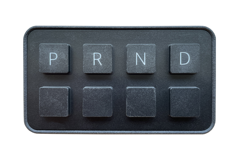 Image of a black control panel with four buttons